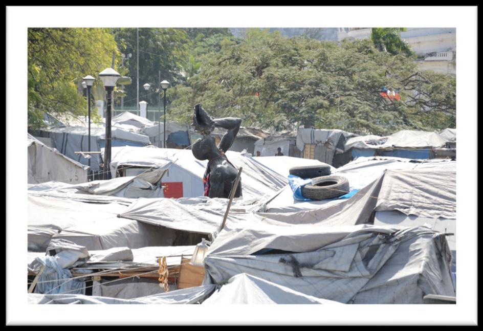 The Marron Inconnu statue amidst the tents of displaced families on Champ de Mars Photo Credit to IOM A schoolgirl walks past the Marron Inconnu statue, previously surrounded by the Champ de Mars IDP