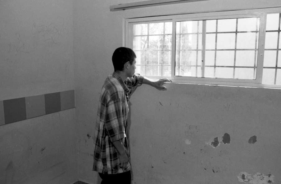 A boy recently removed from the United States considers his future in a DIF shelter on the Mexico side of the border.