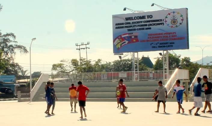 Timor-Leste children playing soccer under an ASEAN People s Forum billboard. Source: aseanpeople.