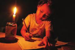 16 News THE MYANMAR TIMES JULY 1-7, 2013 A primary school student does homework by candlelight during a power blackout in Mandalay on June 24.