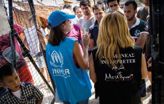 With the help of an interpreter from the Greek NGO METAction, a UNHCR staff member provides procedural and legal information to a group of new arrivals at the identification centre in Mersinidi,