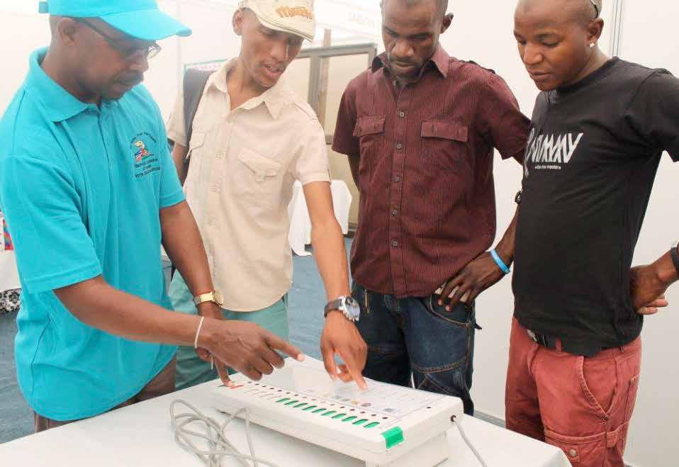 ECN officials demonstrating how to use the EVMs at the Windhoek show Grounds. 3.