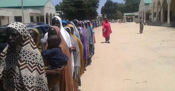 Displaced women line up to try to testify in front of the Presidential Investigation panel Private, September 2017 senior NEMA official told Amnesty International in September 2017 that only a