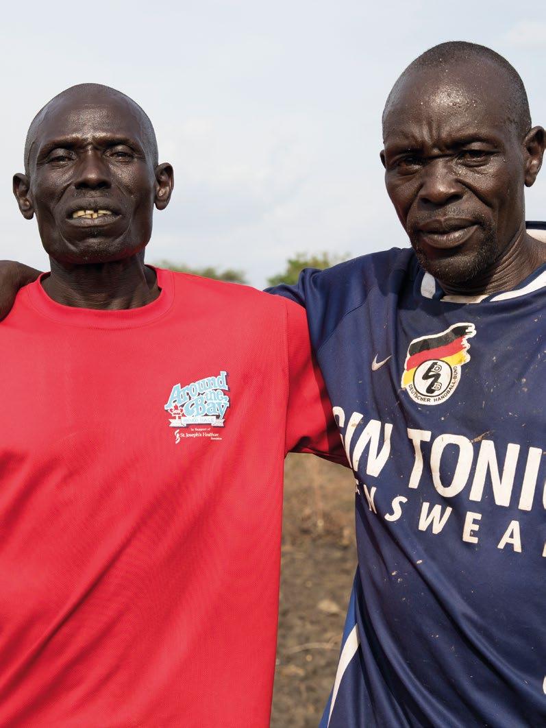 Chapter 7 Uganda. South Sudanese refugee, Mike (right), with local Ugandan community leader, Yahaya.