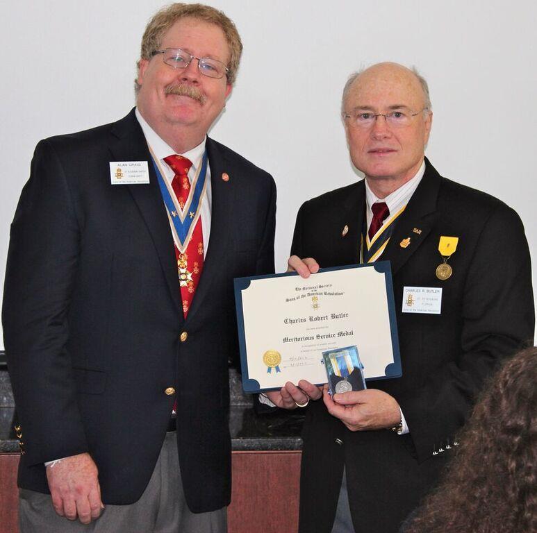 President Craig presents Meritorious Service Award to outgoing