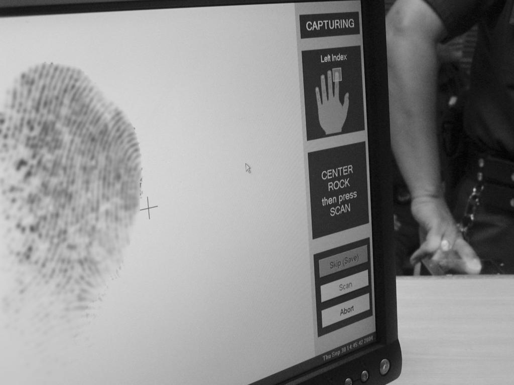 Figure 3: IAFIS Fingerprint Screen (at left) and Reading Machine (at right) at the I-5 San Clemente, California, Checkpoint Source: GAO.