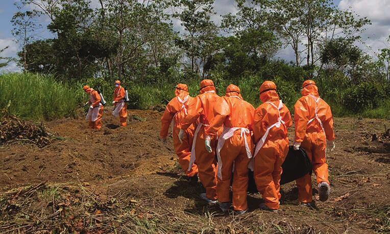 Medical staff carry the body of a victim of Ebola during the response operation in Western Africa.