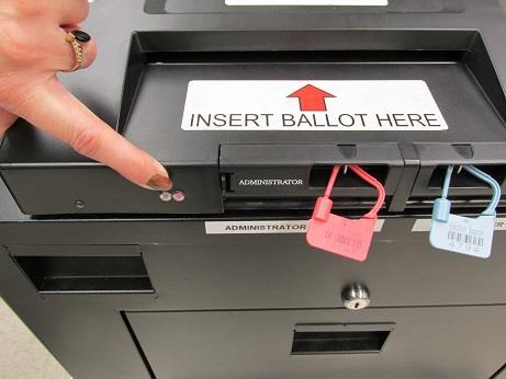 Place the broken seal into the Red Key Bag IMMEDIATELY and remove Poll Worker Data Card.