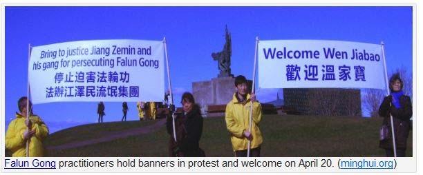 [One main banner practitioners held read Bring to justice Jiang Zemin and his gang for persecuting Falun Gong. Another said simply Welcome Wen Jiabao. Both were in English and Chinese.
