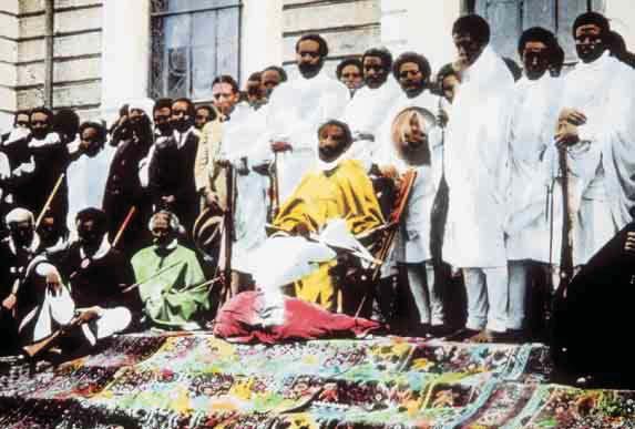 This photograph shows Ethiopia s Emperor Haile Selassie seated in the center, surrounded by Ethiopian dignitaries and supporters.
