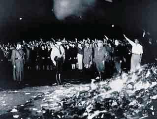 Book burnings Nazis and German students carry books and pamphlets to be burned during a demonstration against literature they believed to be anti-germanic.