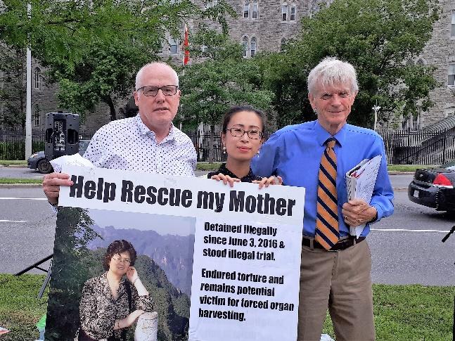 Alex Nieve of Amnesty International, Honggyan Lu and David in front of Chinese embassy in Ottawa today.