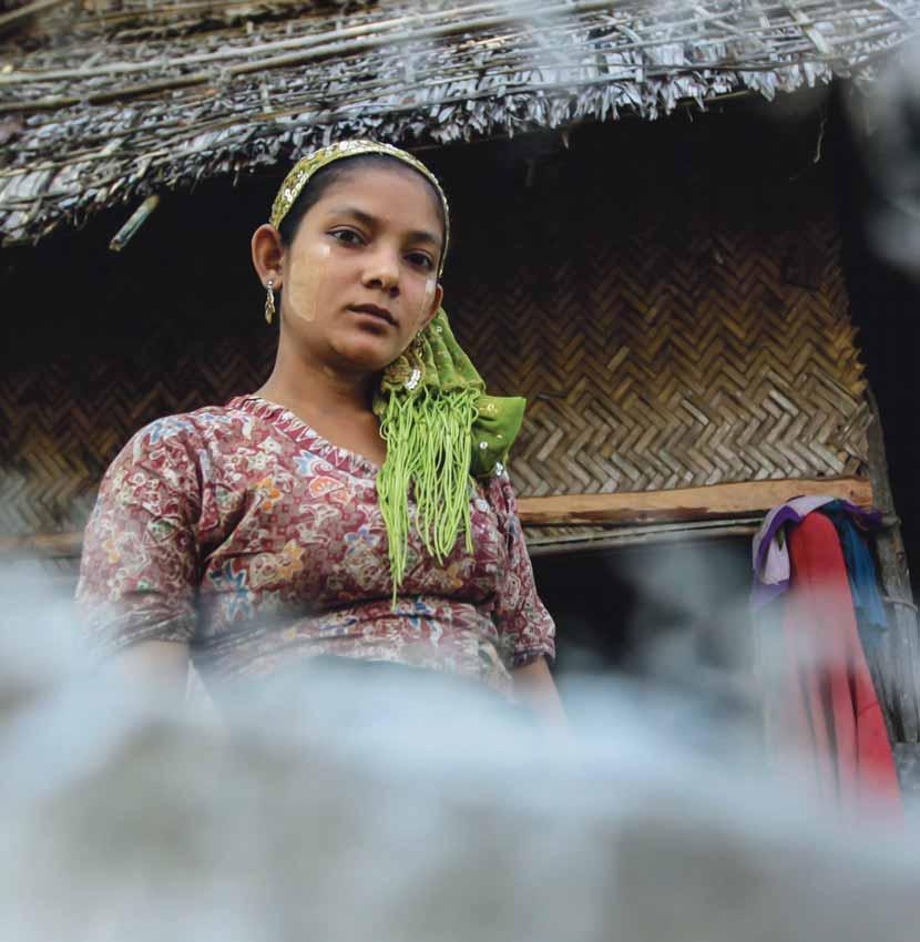 A tense-looking woman in the remote river village of Apawe in Myanmar s Rakhine State.