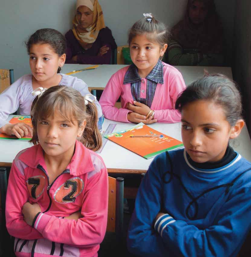 Syrian refugee girls attend class in Lebanon.