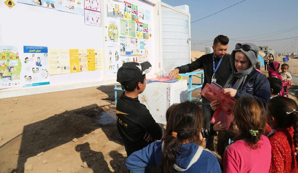 Displaced children at IOM s Haj Ali emergency site, south of Mosul, participate in recreational