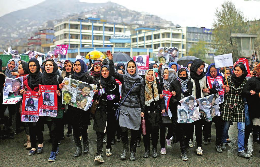 10 world 12 November 2015 Afghan Hazara step up protest after beheadings Women chat slogans during a protest against the killing of seven people from the Hazara community in Kabul, Afghanistan on 11