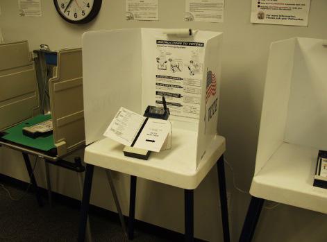 a ballot. Once a voter has finished marking their ballot, they take it to the PBR which is situated above the ballot box.
