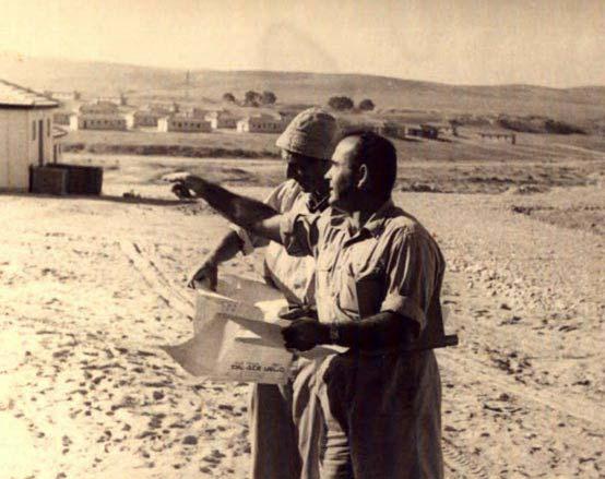 . Fig. 9: Surveyors at a new building site in Beer-Sheva during the 1950's.