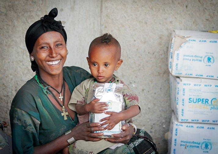 WFP/Michael Tewelde Berhane Workie receives special nutritious food for her children in the health centre of Bella, Ethiopia.