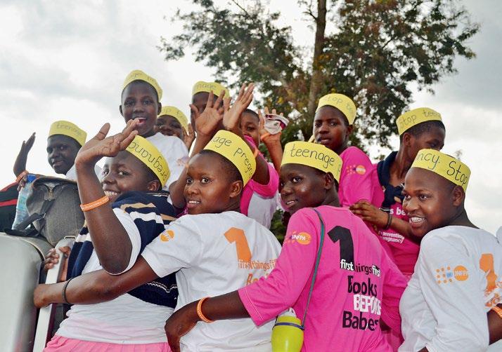 UNFPA Uganda/Martha Songa Pupils of Dube Primary School in t-shirts with messages on preventing teenage pregnancy.