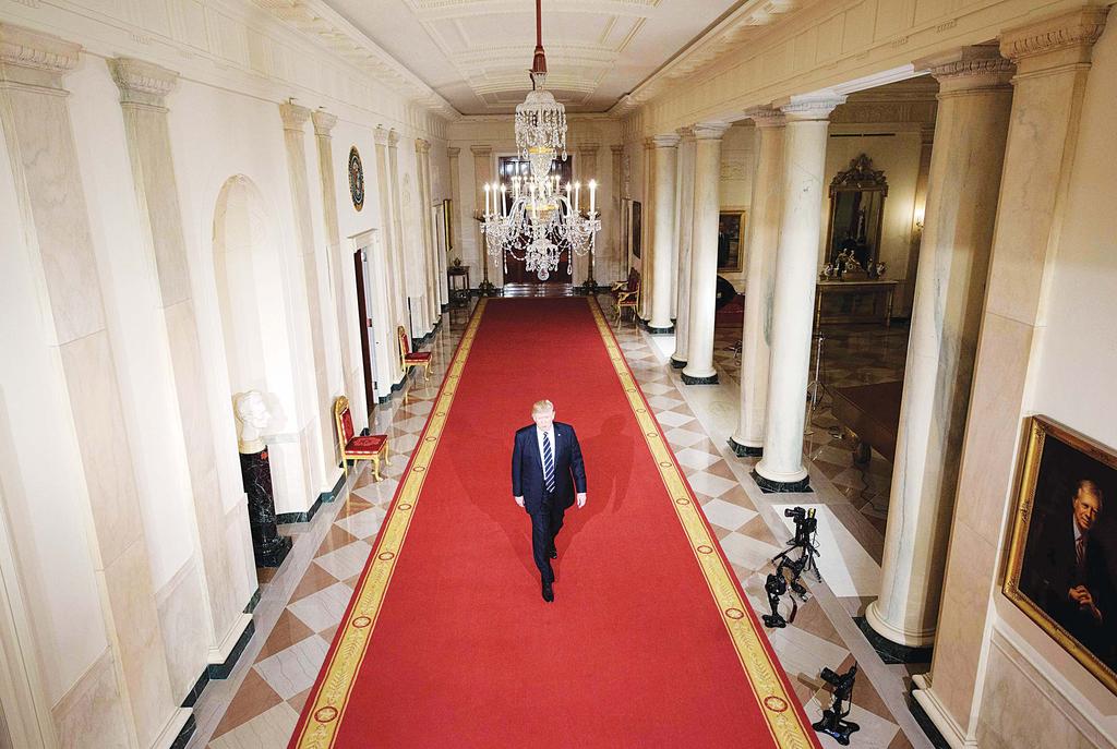 INTERNATIONAL 11 US President Donald Trump walks through the Cross Hall to the East Room to nominate Neil M.