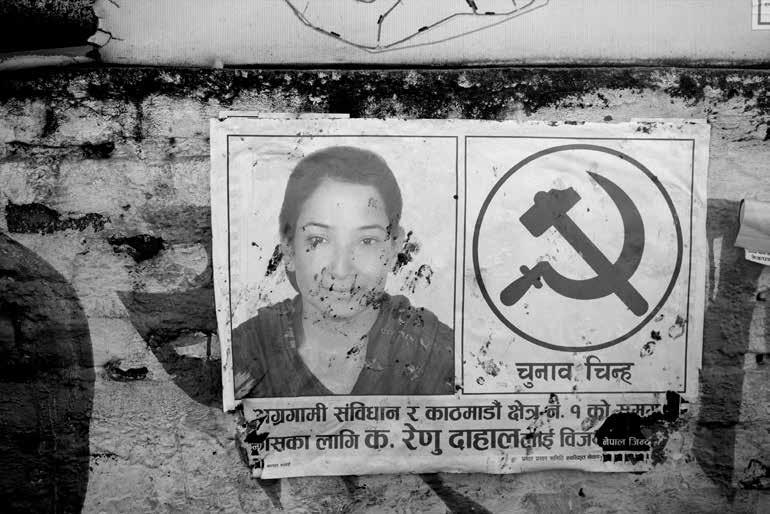 A poster of a woman running for office hangs on a street in Kathmandu. resolved rapidly to ensure effective and timely remedy.