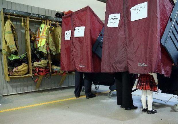 True or False: You can bring your children into the polls with you.