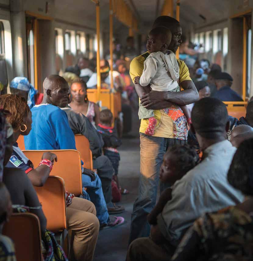 Angolan refugees, some of whom had been living in exile in the Democratic Republic of the Congo for up to 40 years, journey back to their homeland by train from