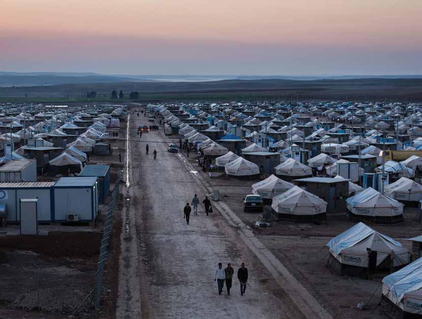 The sun rises over Khanke camp for internally displaced persons in northern Iraq. The camp is home to over 10,000 displaced Iraqis, mainly from Sinjar, who fled their homes in August 2014.