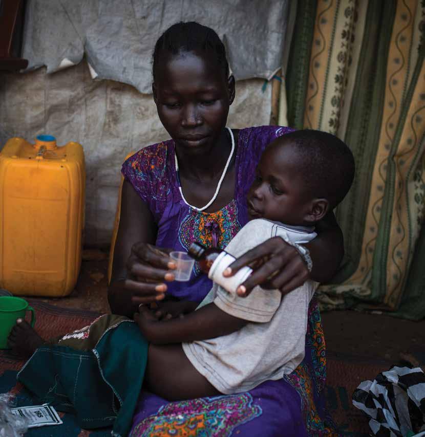 A mother cares for her sick son at Mahad camp for internally displaced persons in Juba,South Sudan.