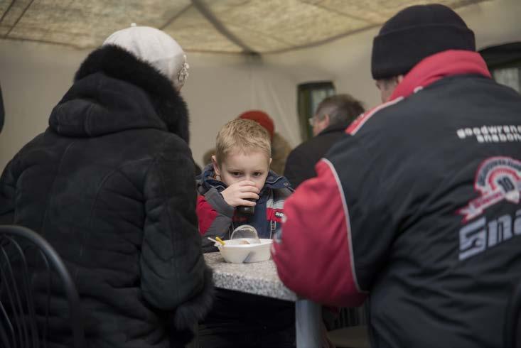 Rapid Response UKRAINE A family eats at a meal distribution site in Ukraine, where more than 1.