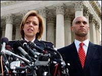 text size A A A Mark Wilson/Getty Images Metropolitan Police Chief Cathy Lanier (left) and District of Columbia Mayor Adrian Fenty face reporters March 18 after the Supreme Court heard oral arguments