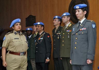 Peacekeepers taking part in an observance of the UN s 60 th Anniversary.