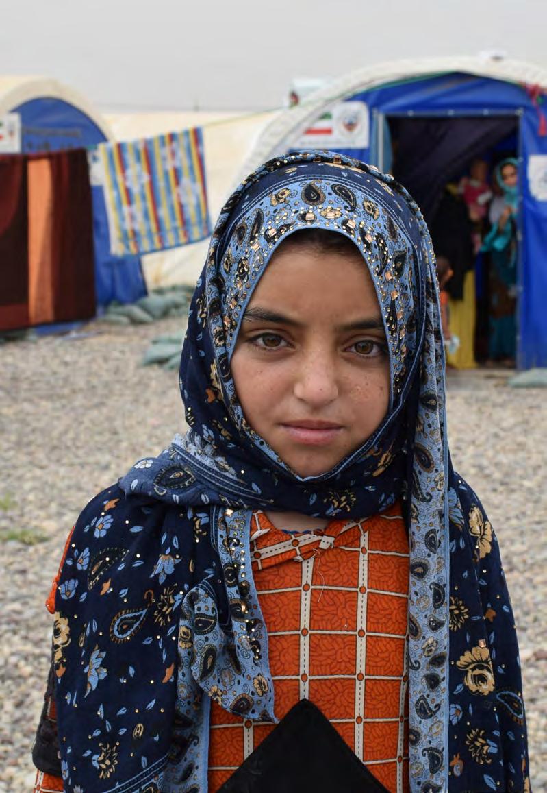 1 (Left) Displaced Iraqi girl from Mosul living in a tent