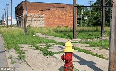 Neglected: Run down buildings and overgrown streets have almost become hallmarks of Detroit since the automotive industry collapsed The 2010 Census data suggests that the settlement pattern of