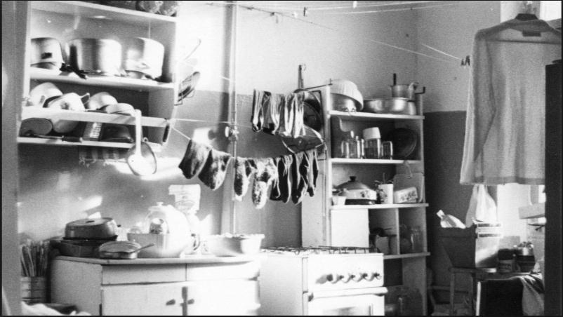b) What does this picture show you about living conditions in urban Russia? Laundry drying in a communal kitchen in Moscow in the 1930s.