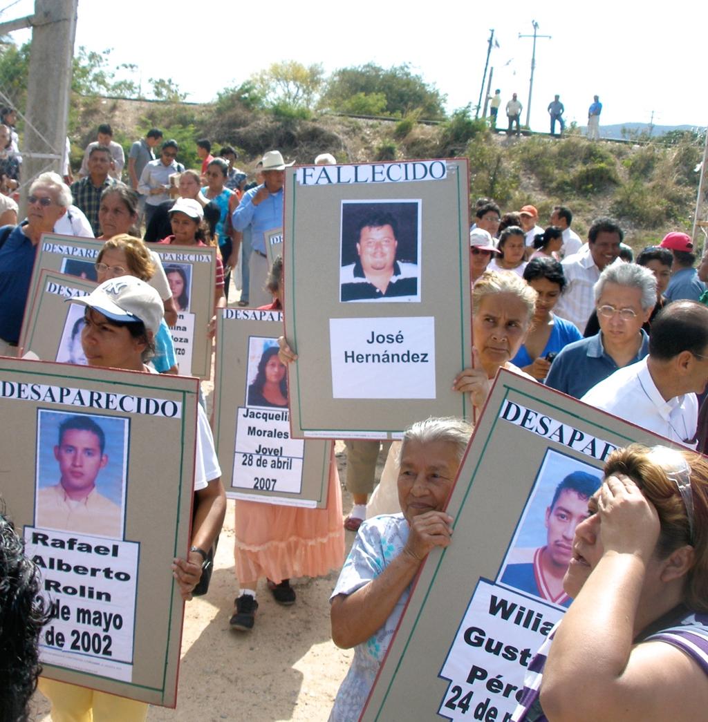 ! Photo, bottom right: Carrying photographs of their loved ones who disappeared while crossing Mexico, Central American families gather at