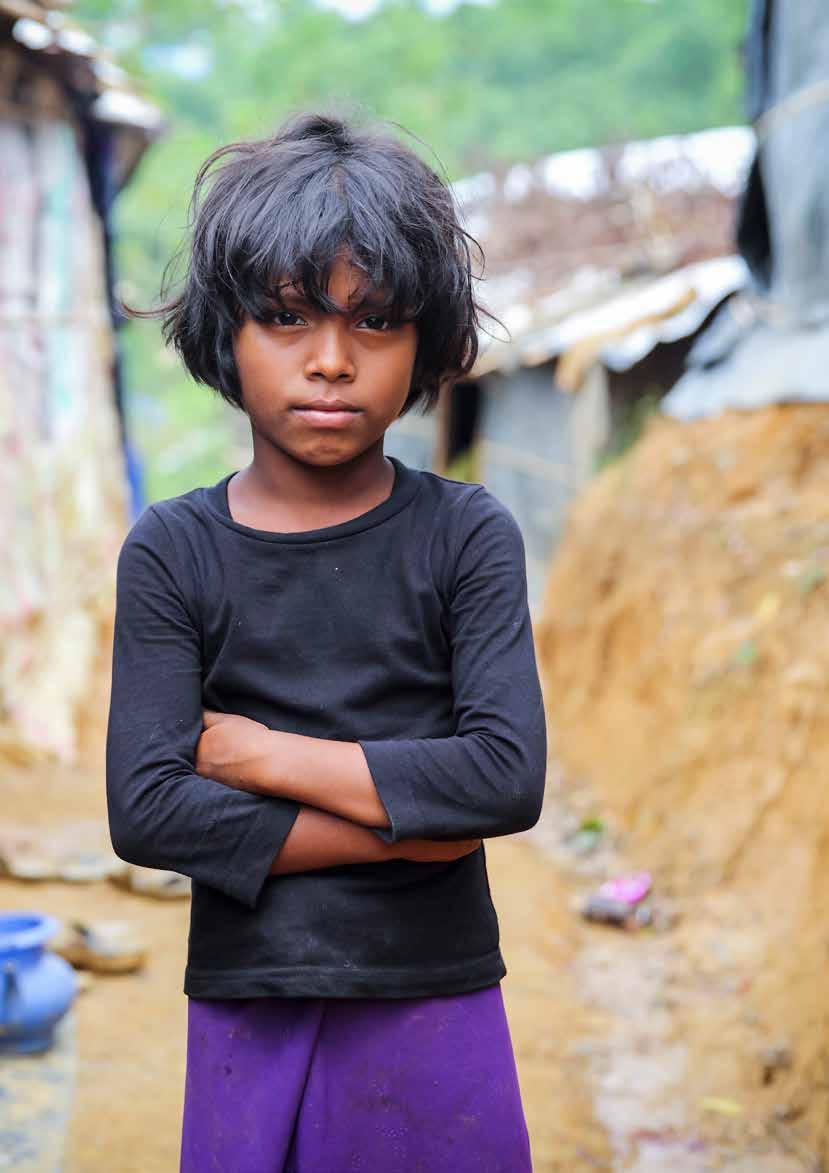 Ayesha*, 8 years-old, pictured outside her family s tent. Her family fled Myanmar when their village was attacked and are now living in a makeshift camp in Cox s Bazar district, Bangladesh.