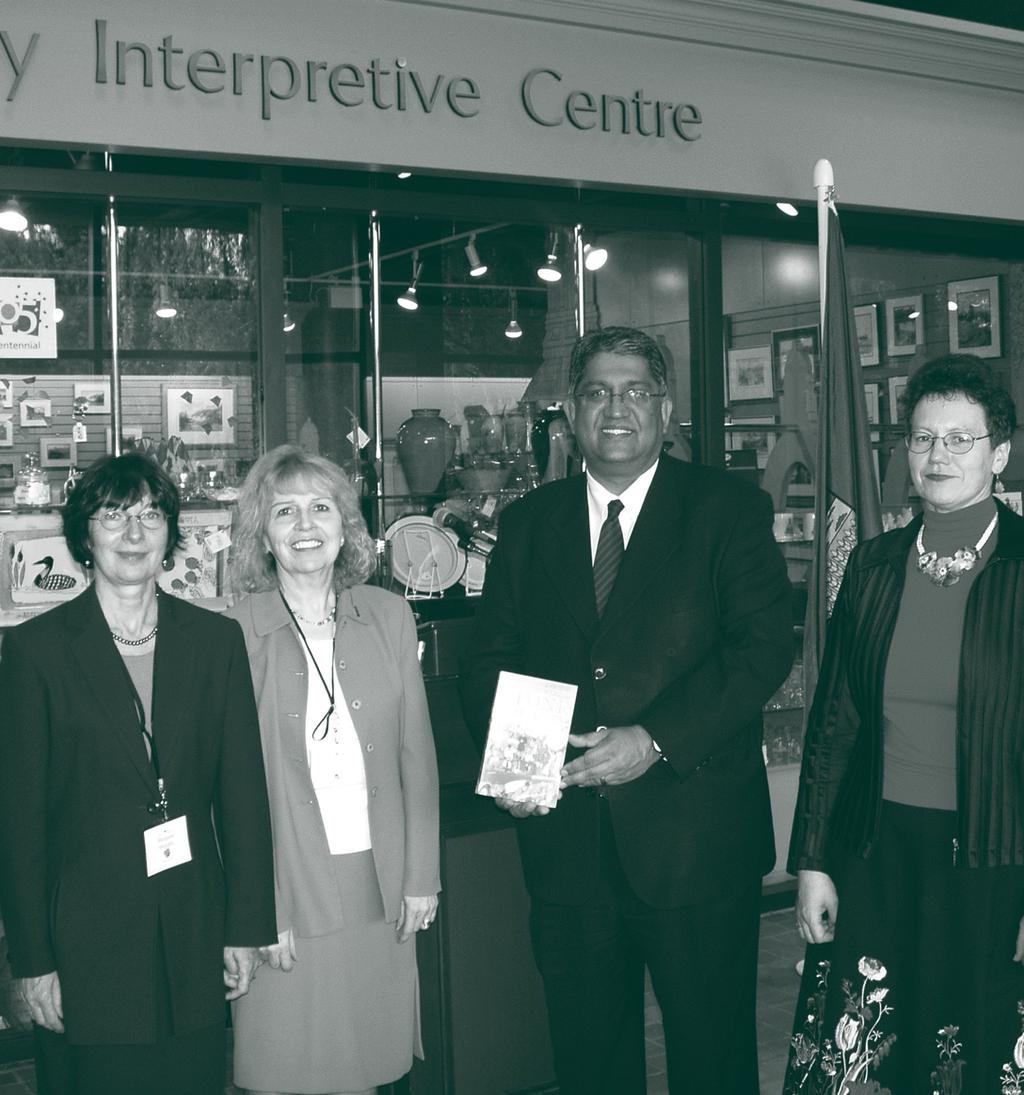 Photo above captures Legislature Librarian Sandra Perry presenting a gift to Deputy Chair of Committees Shiraz Shariff during the 16th Biennial Conference of the Association of Parliamentary