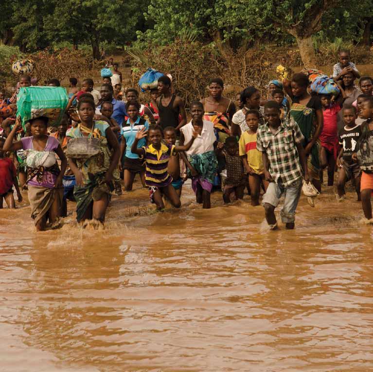Flood victims wading to rescue boats, Makalanga Malawi.