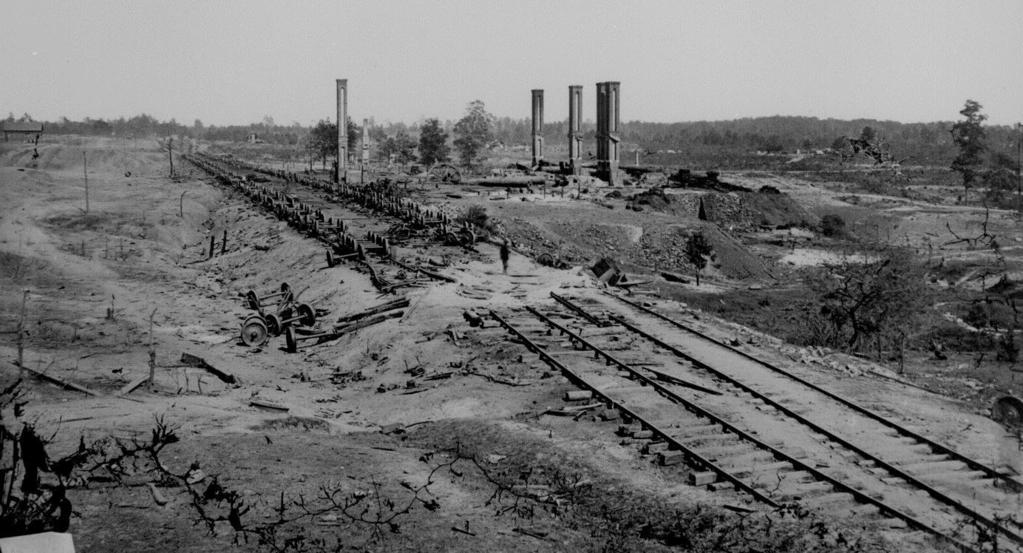 Georgia in 1865: Ruins of train tracks and mill in Atlanta Image 6 Describe the damage in the photo.
