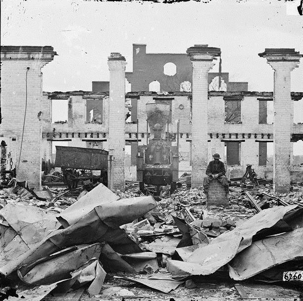Virginia in 1865: Railroad depot in Richmond Image 1 Describe the damage in the photo.