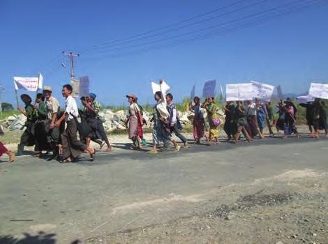 They show a demonstration against Kaung Myanmar Aung Company because of land confiscations in Ak--- village, Ab--- village, and Ac--- village.