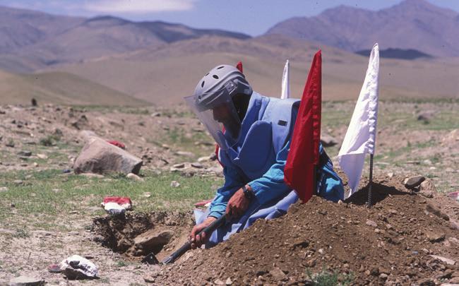 2014 UNMAS Annual Report STRATEGIC OBJECTIVE ONE Afghan deminer at work. In 2014, clearance in Afghanistan resulted in mine-free status of 237 communities.