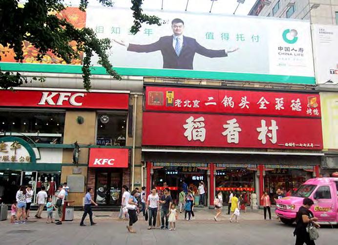 Beijing. KFC and Chinese advertising for insurance and products. Source: Steve Weingarth Finding a new job after losing another is easier than it might be in a town or small city.