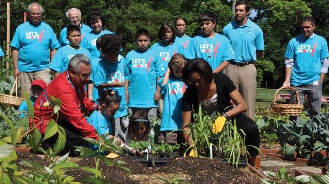 18 Toward A New Era NCAI President Jefferson Keel and First Lady Michelle Obama surrounded by Native youth, Assistant Secretary for Indian Affairs Larry Echohawk, IHS Director Yvette Roubideaux, and