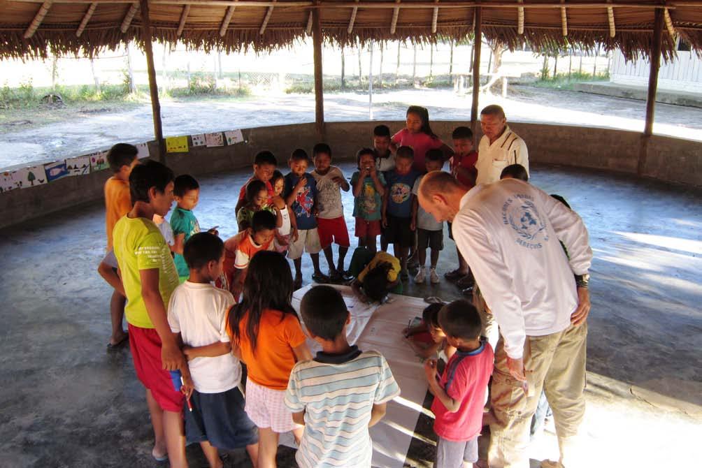 OHCHR/Colombia OHCHR staff carrying out awareness-raising activities with children in Guaiania, Colombia.