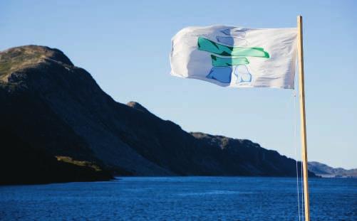 Figure 10-8 After the signing of the Labrador Inuit Land Claims Agreement in 2005, the Nunatsiavut flag flies over Torngat Mountains National Park Reserve, included under the land claim.