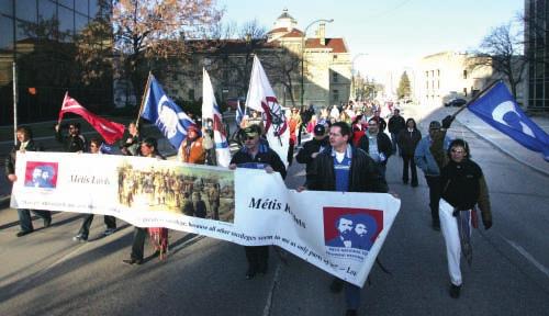 Figure 10-7 In April 2006, members of the Métis community marched to the Manitoba Law Courts in Winnipeg in support of the largest Métis land claim in Canada. expected to appeal this decision.