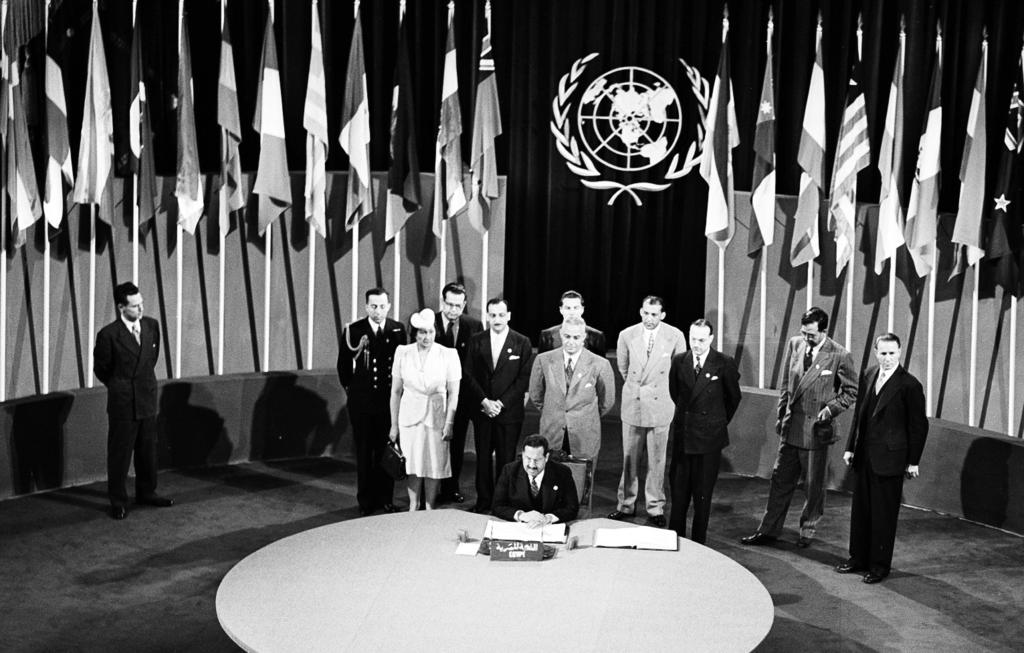 The San Francisco Conference: Egypt Signs the United Nations Charter Abdel Hamid Badawi Pasha, Minister of Foreign Affairs; Chairman of the Delegation from Egypt, signing the Charter at a ceremony